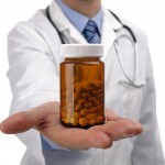 Doctor or pharmacist holding a bottle of pills