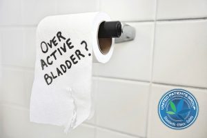 Close-up of toilet paper roll with text asking about bladder iss